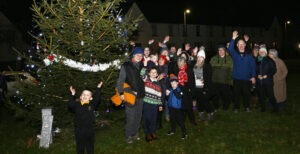 Cheers as the lights are switched on by the Claggan Residents Association Photograph: Iain Ferguson, alba.photos NO F50 Claggan Residents lights 02