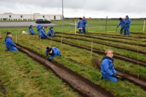 Pupils from Drumlemble Primary School hard at work planting trees.