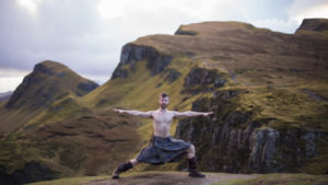  Finlay strike a yoga warrior pose in the Quiraing. Kilted yoga o4