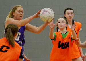 Falcons' Sarah Congdon is on the ball facing a challenge from Isla Culbertson (centre) and Orla Soe-Paing. Photograph: Iain Ferguson, alba.photos NO F07 Netball action 03