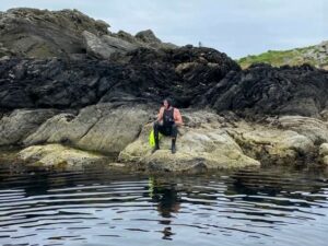 Eddie 'clambered' on to some rocks after reaching Gigha in less than an hour.