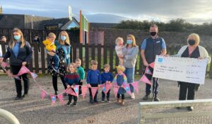 Staff and youngsters from Meadows Under Fives Nursery were presented with their cheque.