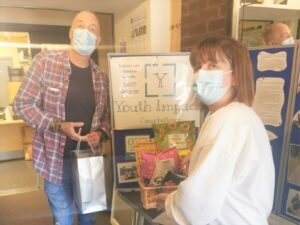 Youth worker Phil Edwards and Kintyre Care Home wellbeing coordinator Susan Ellis swap goodies during the gift exchange.