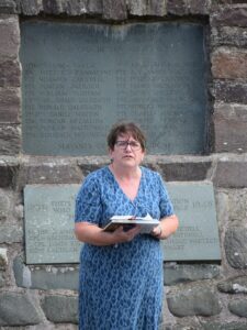 War memorial trustee Marion McDonald welcomed people to the service.