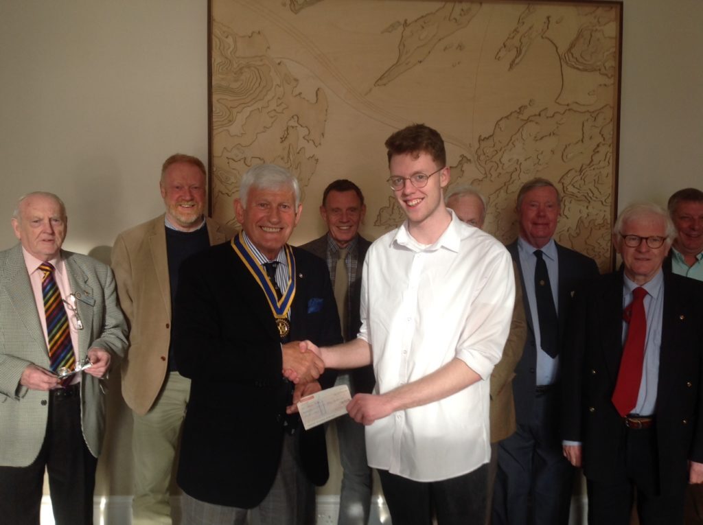 Adam Hill from North Connel accepting a cheque for £150 from Oban Rotary President, Iain MacIntyre. NO_T19_ObanRotary