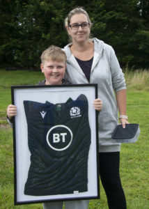 Marc McCook, aged 10, and his mum, Becky, celebrate him being the lucky winner of the Scotland rugby top raffle . Photograph: Iain Ferguson, alba.photos NO F37 MINDFIT FUND RAISER 03