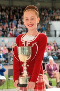 Cowal champion Korri McMillan with the Margaret Tait Challenge Trophy. Photograph: Ronnie Cairns.