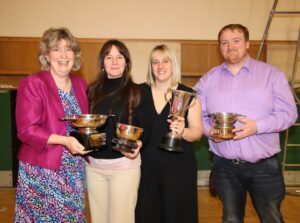 Robert Black's wife Catherine, left, presented a new trophy, the Robert Black Memorial Prize, to Dalintober Drama Club. She is pictured with Tracy Brogan, Claire Mitchell and Fraser Cosgrove, Dalintober Primary School's youth work team, who run the drama club as an extra-curricular activity.